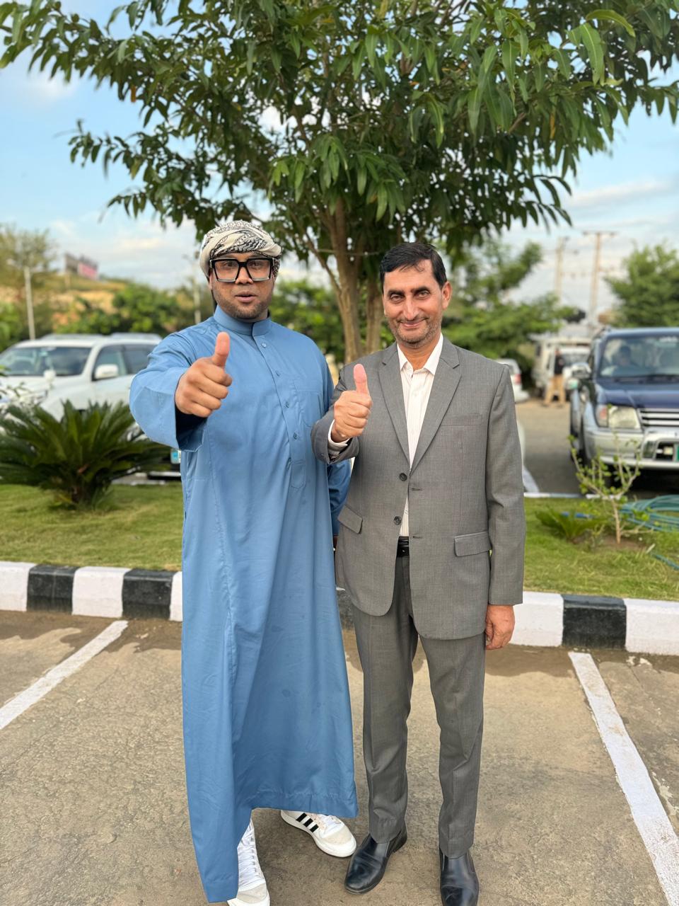 Mohamed Sameer Ismail with a KORT team member outside the campus