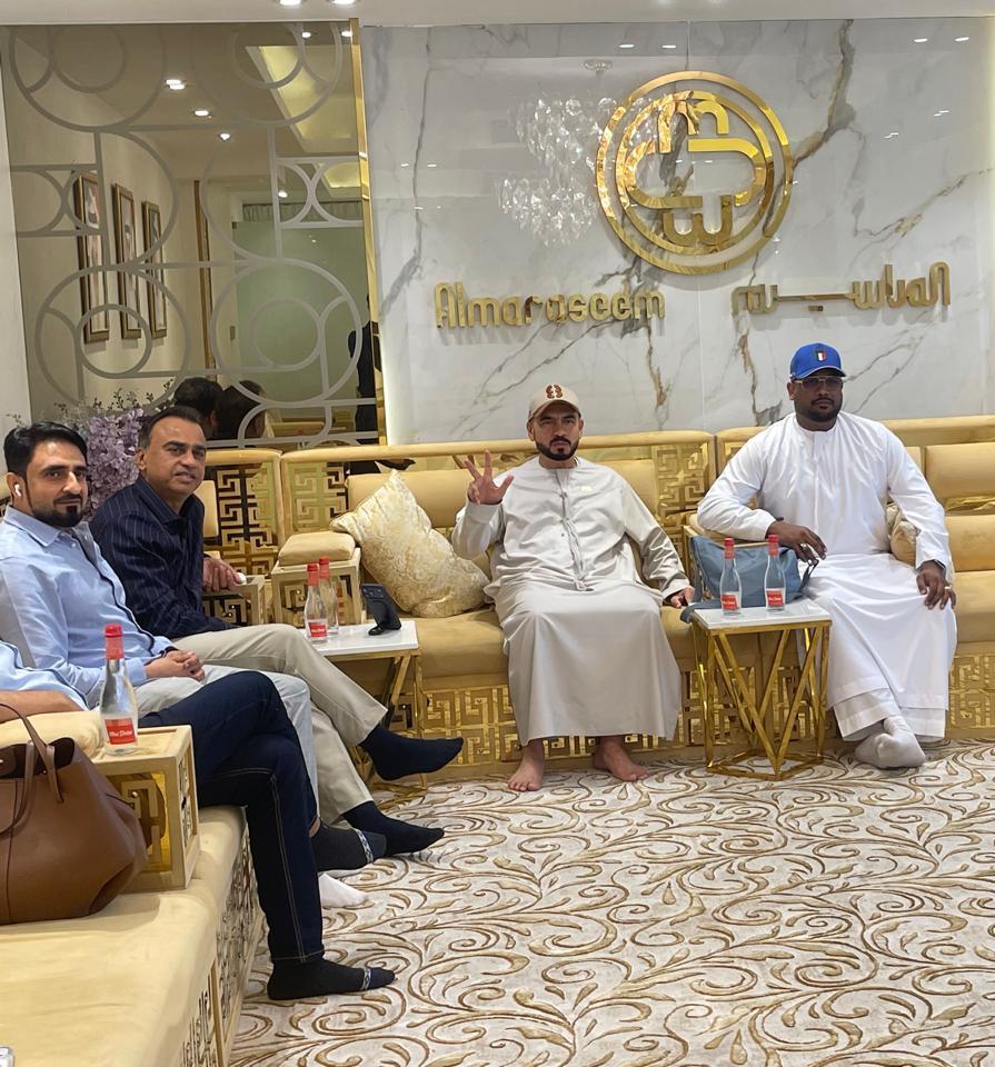 Mohamed Sameer Ismail seated with business associates at a UAE gathering