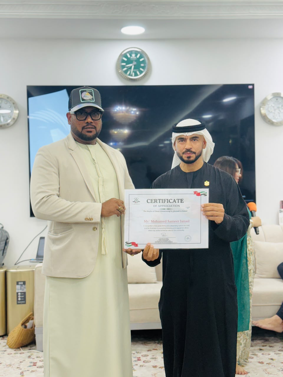 Close view of Mohamed Sameer Ismail receiving a certificate of appreciation