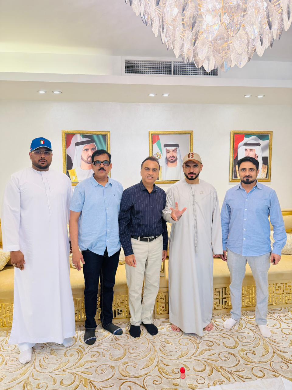 Mohamed Sameer Ismail standing with business associates at a UAE gathering